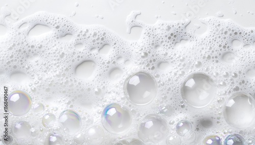 Close-up of white foam with iridescent bubbles.