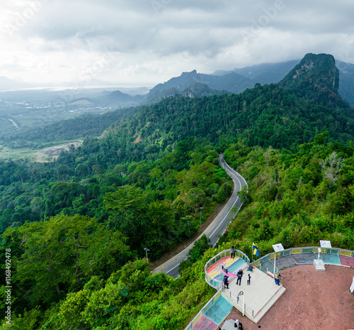 Aerial drone view of  mountain viewpoint surrounded with greenery rainforest at Wang Kelian, Perlis, Malaysia. photo