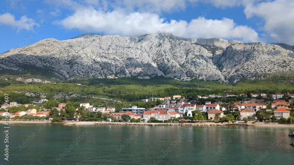 European small seaside town nestled by dramatic mountains, Europe, Mediterranean European small seaside town nestled by dramatic mountains, Europe, Mediterranean