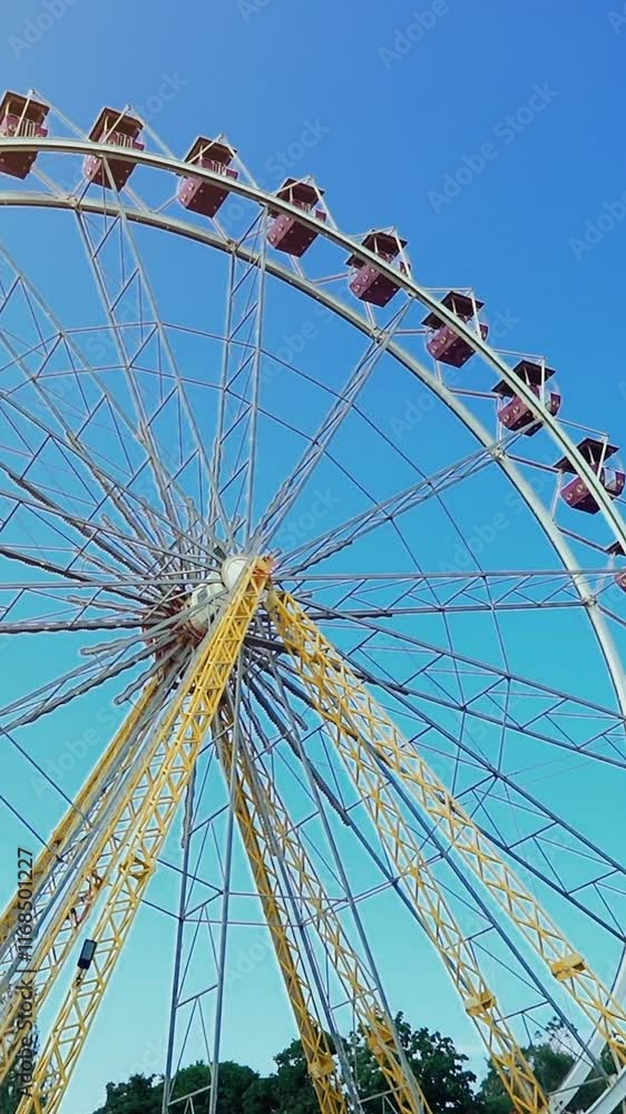 Ferris wheel is located in the fun park zone Vertical video