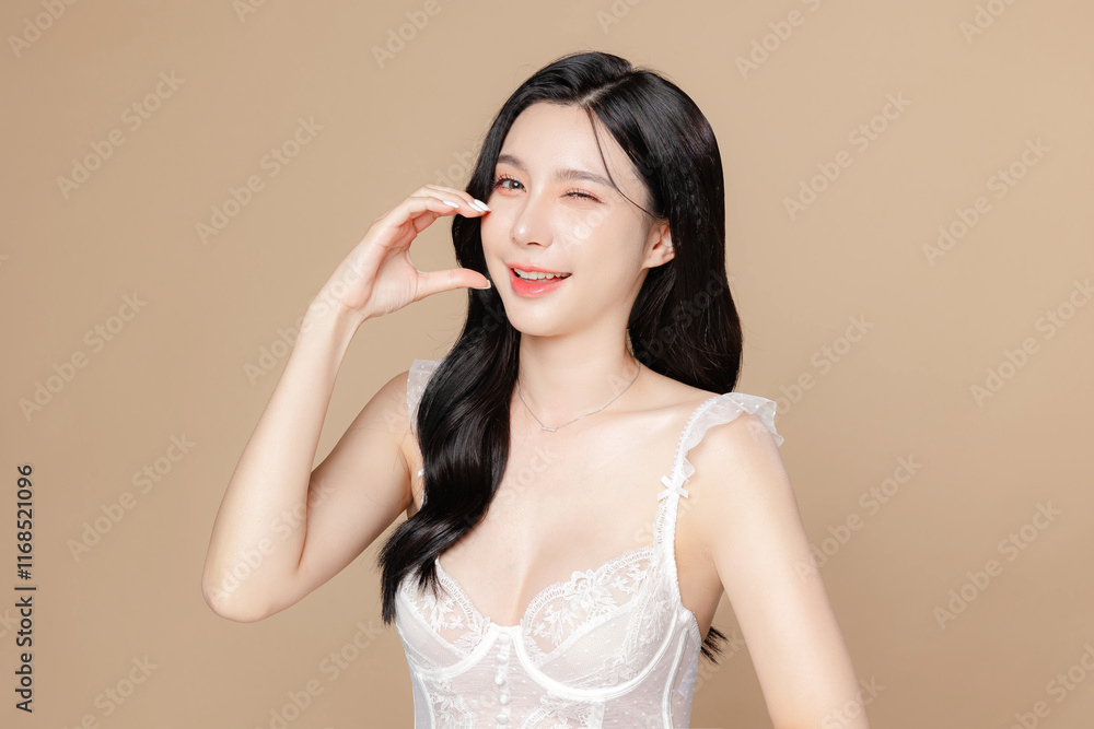 Young Asian beauty woman long hair in white lingerie with korean makeup style on face and perfect skin on isolated beige background. Facial treatment, Cosmetology, plastic surgery. Young Asian beauty woman long hair in white lingerie with korean makeup style on face and perfect skin on isolated beige background. Facial treatment, Cosmetology, plastic surgery.