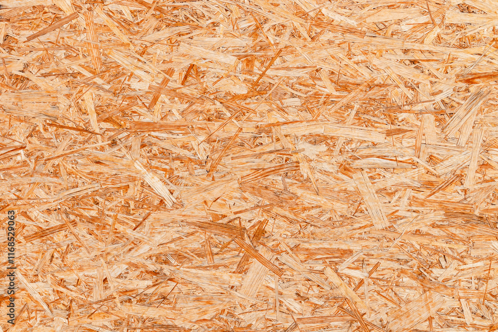 The texture of the OSB material, the recycled pressed wood chips, the texture of plywood. close up The texture of the OSB material, the recycled pressed wood chips, the texture of plywood. close up