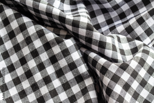 black and white checkered fabric pattern background and texture photo