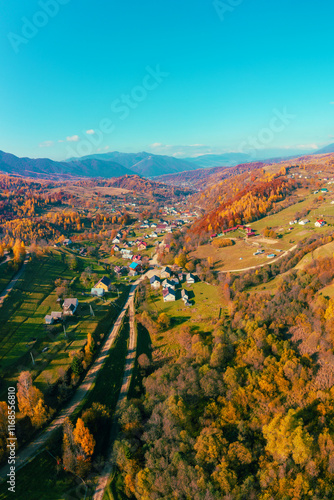 Obraz na płótnie Panoramic view from above of colorful mountain slopes on a sunny autumn day. Beautiful landscape. Carpathian mountains, Kolochava, Ukraine. Vertical photo w salonie