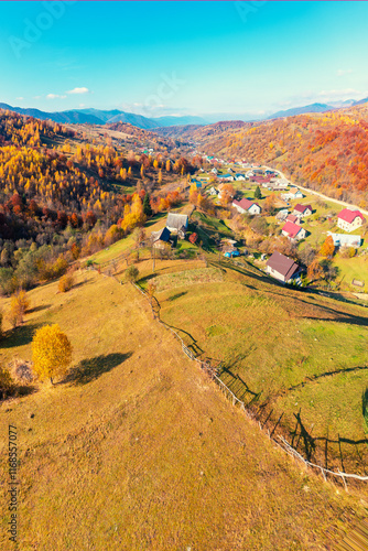 Panoramic view from above of colorful mountain slopes on a sunny autumn day. Beautiful landscape. Carpathian mountains, Kolochava, Ukraine. Vertical photo photo