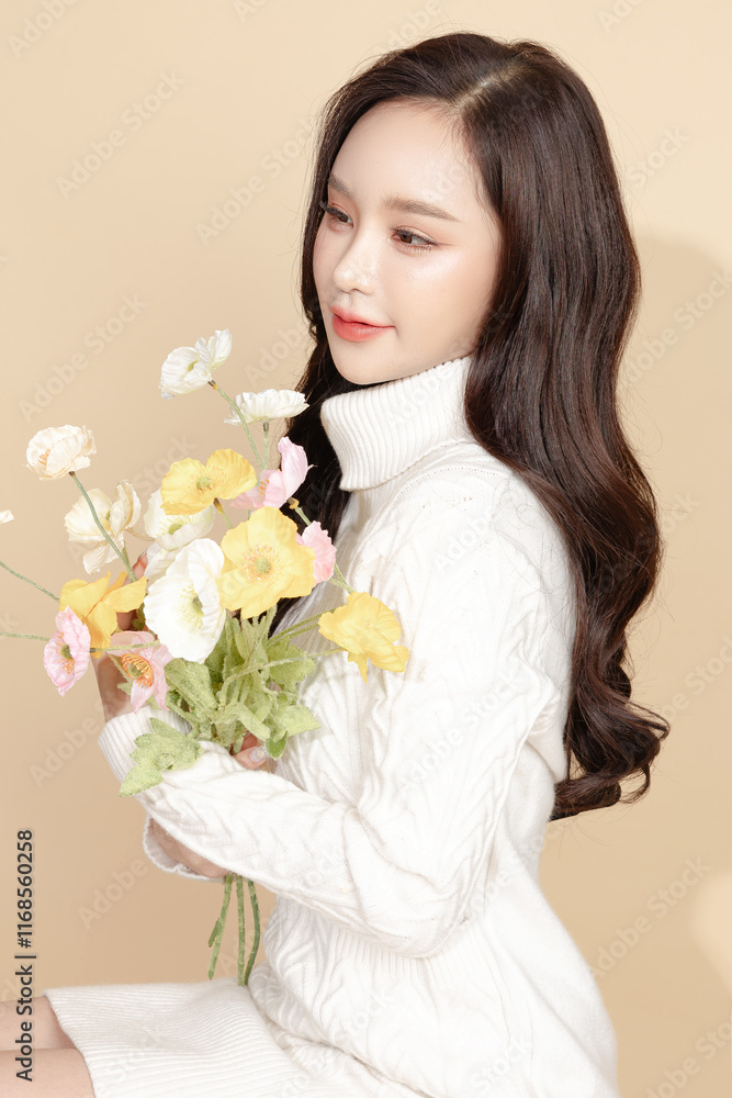 Young Asian beauty woman long back hair in sweater with Koreans makeup style on face and perfect clean skin on isolated beige background. Facial treatment, Cosmetology, plastic surgery. Young Asian beauty woman long back hair in sweater with Koreans makeup style on face and perfect clean skin on isolated beige background. Facial treatment, Cosmetology, plastic surgery.