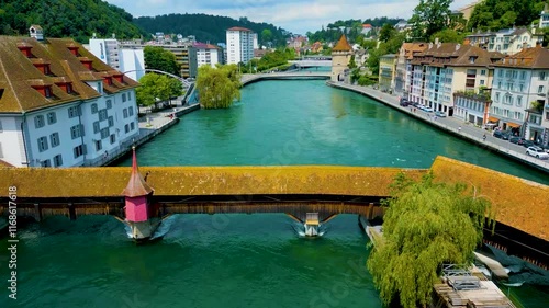 4K Drone Video of the Spreuerbrücke Bridge and Lucerne Needle Dam on the Reuss River near Lake Luzerne in Lucerne, Switzerland photo