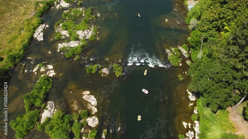 Rafting, Tubing, Kayaking Down Rapids on North Umpqua River, Near Roseburg Oregon. Aerial View, Summer Time Low Water line Showing green Islands photo