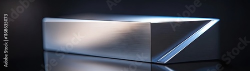 A sleek, metallic block with a sharp edge reflecting light.
