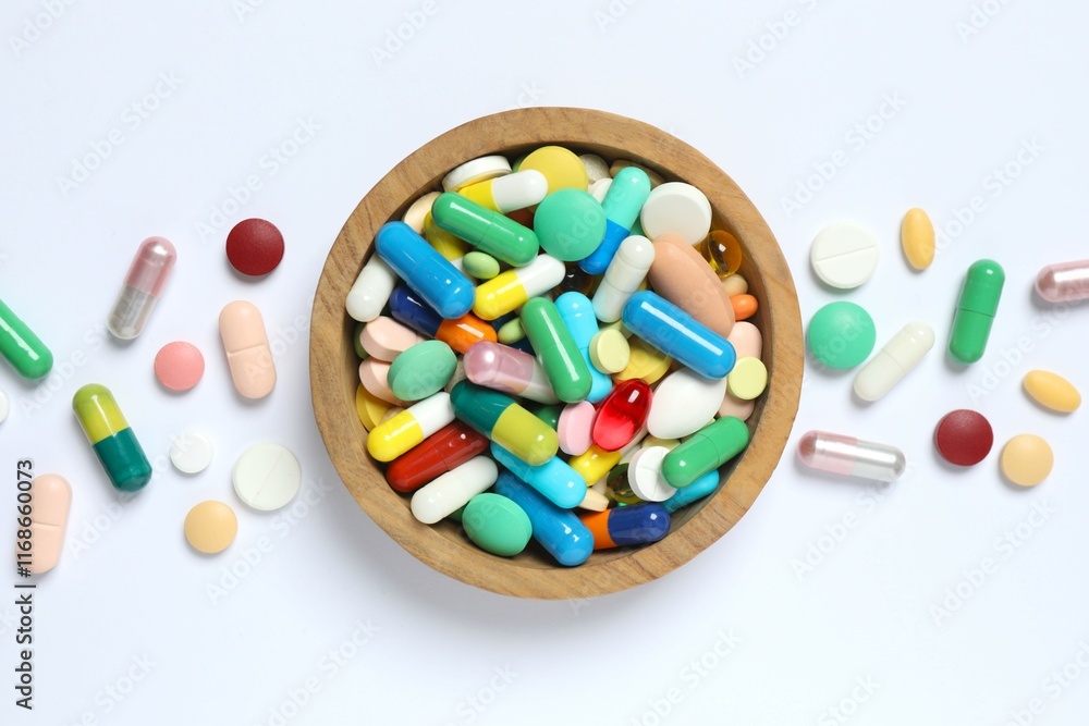 Various pills in a bowl on white background Various pills in a bowl on white background