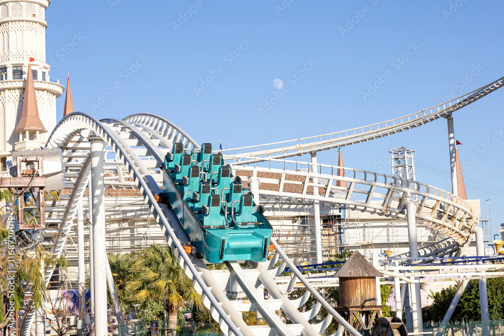 Obraz premium Roller coaster rails at a theme park, no people.