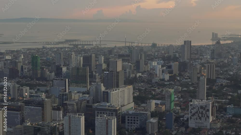 Cinematic drone view of Cebu city, Cordova link expressway in the background Cinematic drone view of Cebu city, Cordova link expressway in the background
