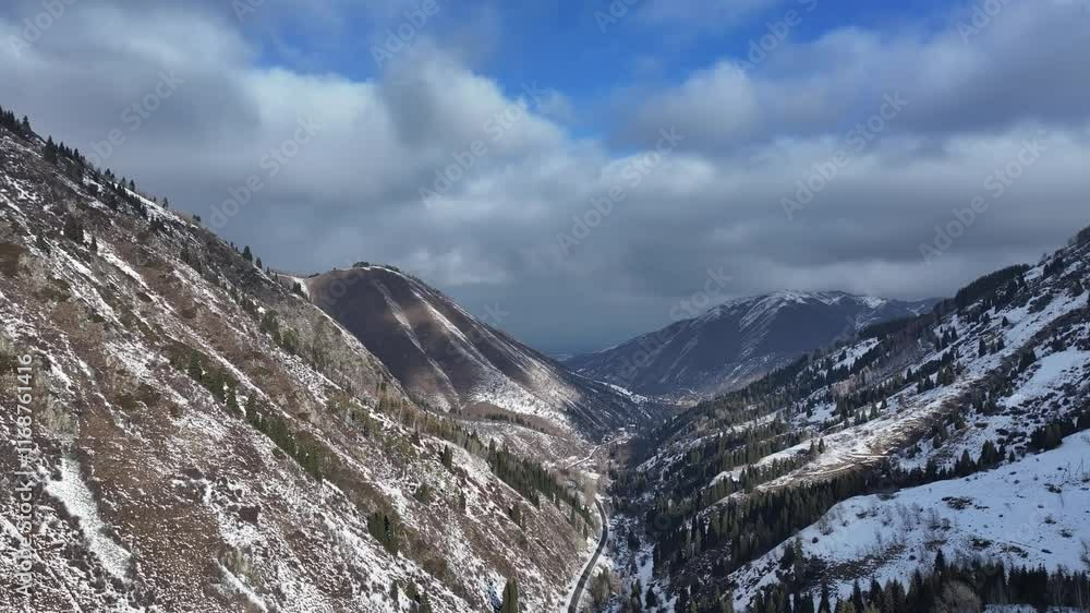 Picturesque gorge in the Trans-Ili Alatau mountains near the Kazakh city of Almaty on a cloudy winter day Picturesque gorge in the Trans-Ili Alatau mountains near the Kazakh city of Almaty on a cloudy winter day