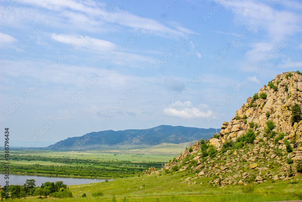 View of the valley and mountains on a sunny summer day. Kazakhstan View of the valley and mountains on a sunny summer day. Kazakhstan