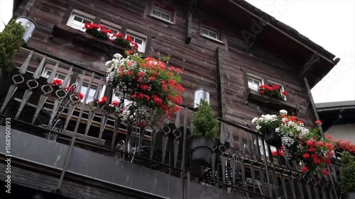 Wallpaper Mural Alpine Charm: Flower-Adorned Balcony of a Rustic Wooden House  Torontodigital.ca