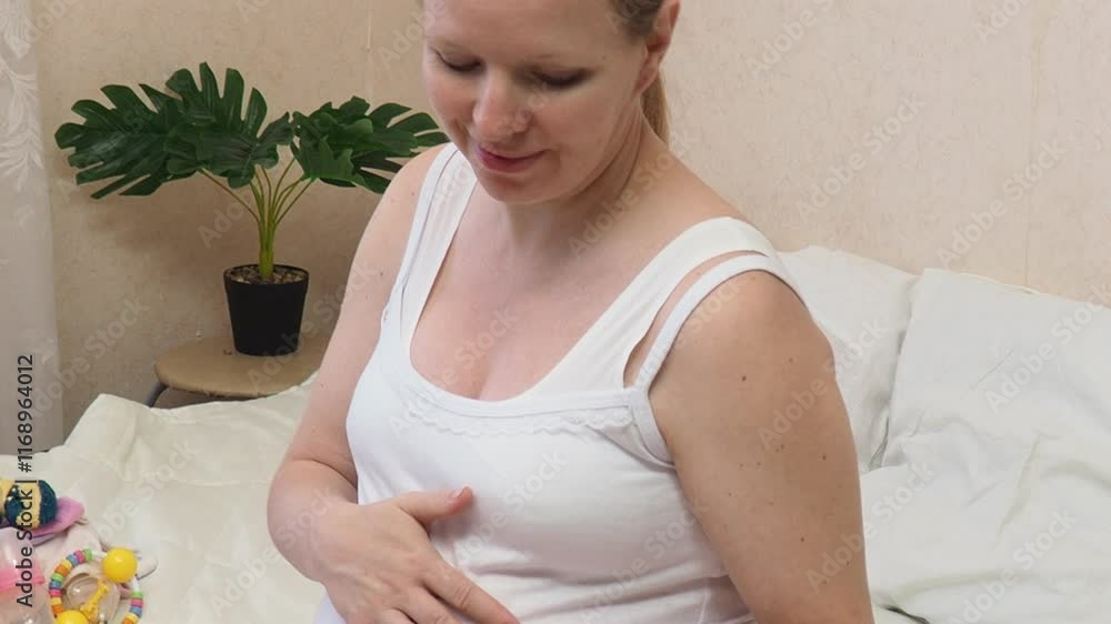 Ultrasound picture pregnant baby photo. Woman hands holding ultrasound pregnancy image at home on the bed. Concept of pregnancy, maternity, expectation for baby birth Ultrasound picture pregnant baby photo. Woman hands holding ultrasound pregnancy image at home on the bed. Concept of pregnancy, maternity, expectation for baby birth