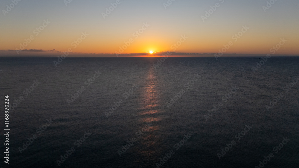 Naklejka premium Drone aerial view of sea during sunrise