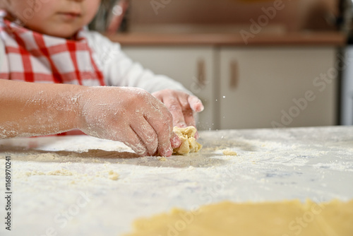 Wallpaper Mural Little cool girl kneading dough on the table     Torontodigital.ca