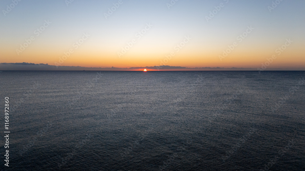Fototapeta premium Drone aerial view of sea during sunrise