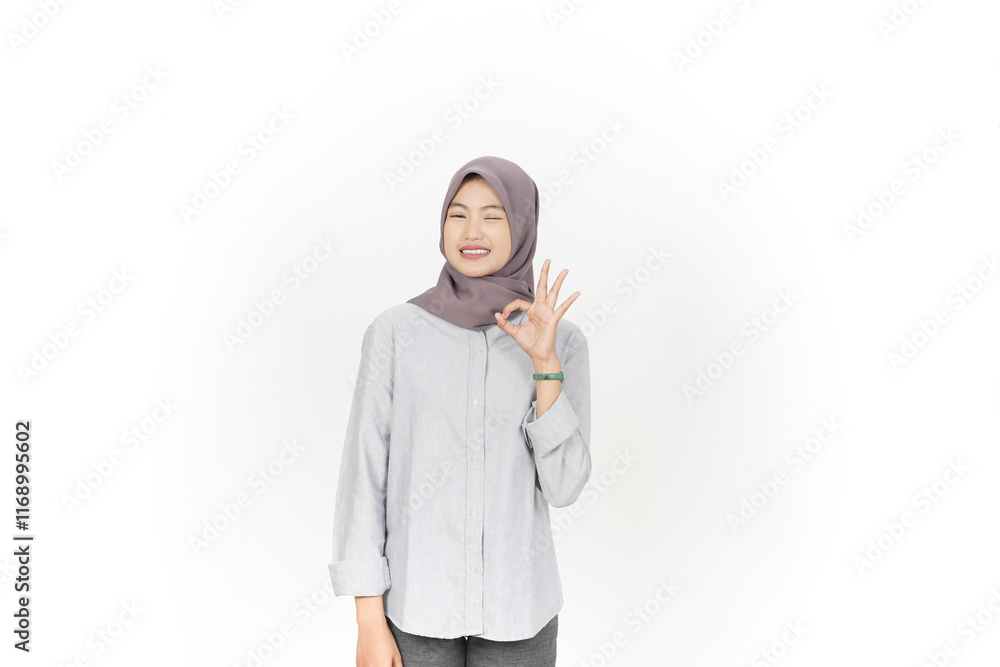 Smiling and showing okay sign, Approve sign Of Beautiful Asian Woman wearing hijab Isolated On White Background