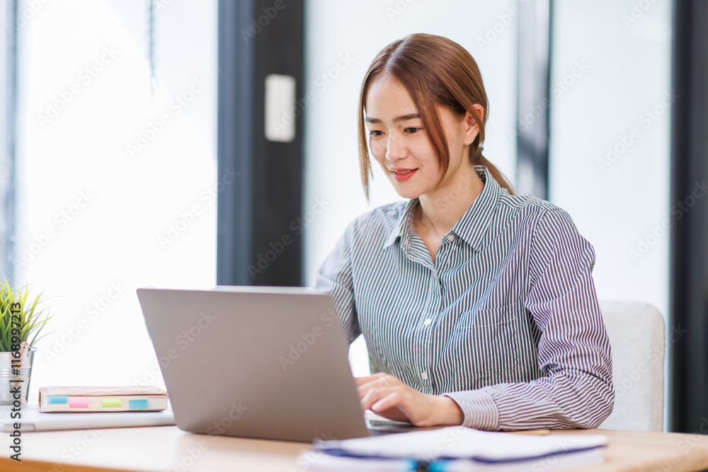 Asian businesswoman work on laptop computer at the office with calculator document on desk, doing planning analyzing the financial report, business plan investment, finance analysis concept.
Asian businesswoman work on laptop computer at the office with calculator document on desk, doing planning analyzing the financial report, business plan investment, finance analysis concept.
