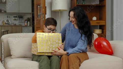 Joyful birthday surprise for a child in a cozy living room setting