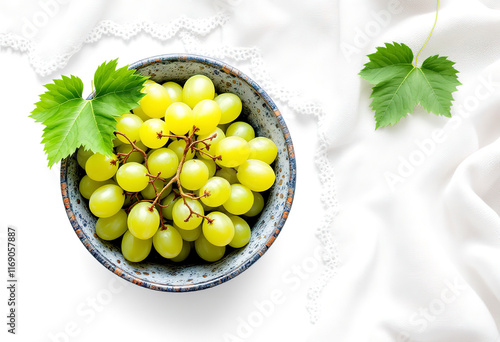 Top view a green grape in a bowl isolated on white background