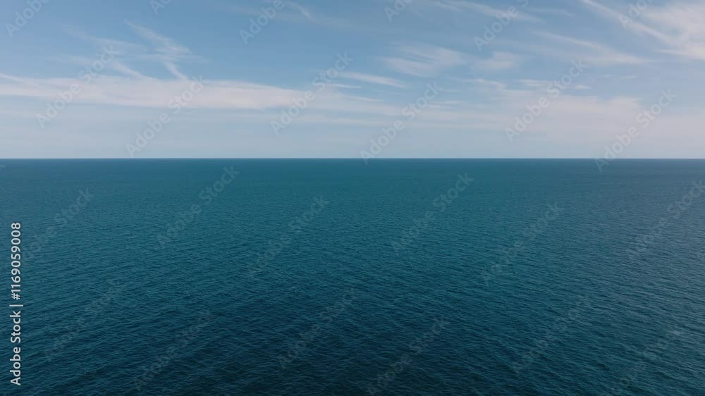 Vast clear blue sea with a distant horizon and bright sunny sky above. Koh Tao, Thailand. Vast clear blue sea with a distant horizon and bright sunny sky above. Koh Tao, Thailand.