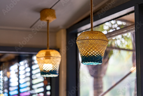 Handwoven Bamboo Pendant Lamps with Blue Glass Accents in Cozy Interior