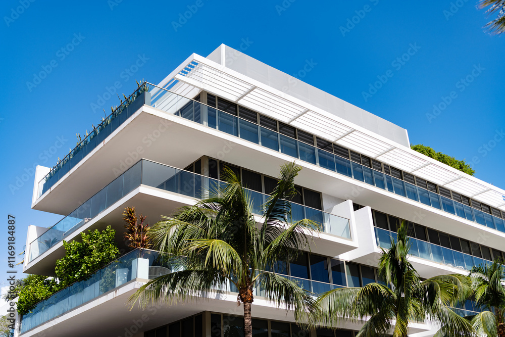 Obraz premium Modern building with balcony. Architectural building in Miami beach. Building perspective view. Hotel architecture. Architecture of modern building. Perspective residential house