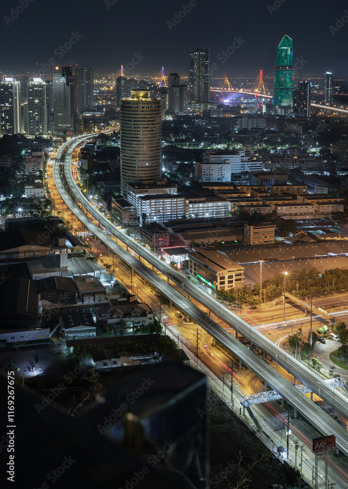 Nightscape view of with bright glowing lights after sunset. Night view of light trails of cars on the road of Bangkok city, Long exposure for Light curve lines, use it as your Wallpaper, Poster, Space