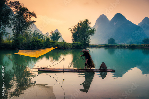 Villager with traditional fishing on bamboo raft over the river in misty morning at Phong Nam Valley photo