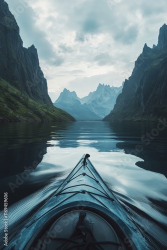 Kayaker paddles through calm waters surrounded by mountains and forest in a s...