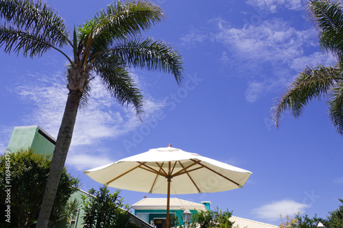 Parasol with blue sky in the background on a beautiful summer day