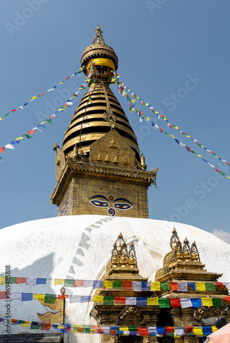 Nepal - Kathmandu: Stupa von Swayambunath mit Augen Buddhas und Gebetsfahen photo