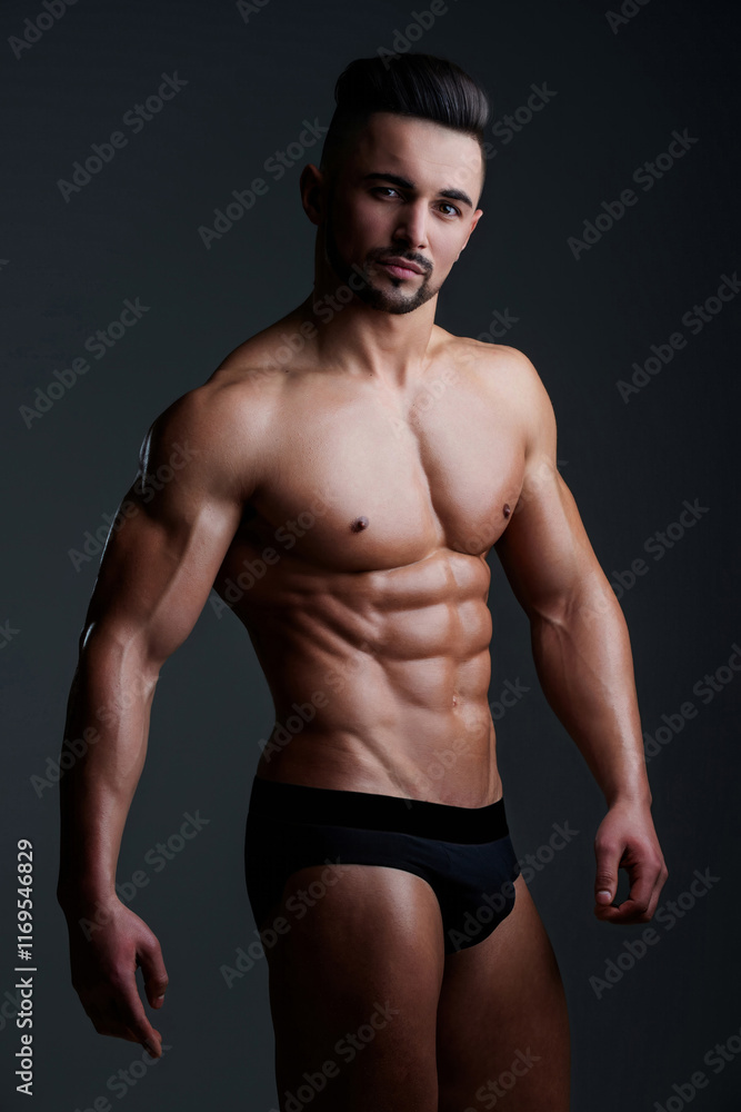 Fototapeta premium Male underwear. Sexy man in muscular naked body in sexy underwear. Seductive male model with muscles in underwear. Handsome young guy with perfect muscular body, torso posing in boxers underwear.