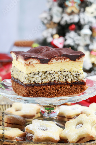 Obraz na płótnie Multi layer cake with vanilla, poppy seed and chocolate among Christmas decorations. w salonie