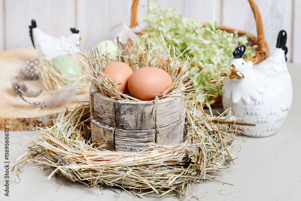 Cute Easter decorations with ceramic hen figurines, eggs and green flowers.