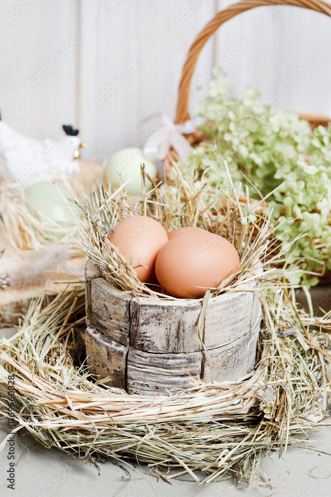 Cute Easter decorations with ceramic hen figurines, eggs and green flowers.