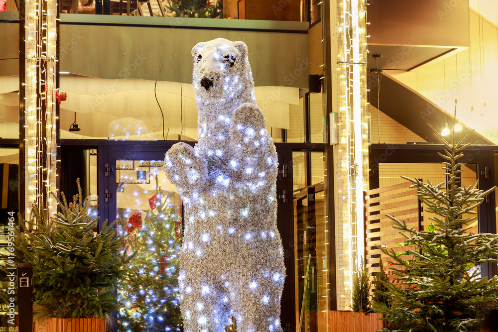 ZAKOPANE, POLAND - DECEMBER 25, 2024: Glowing bear figure made of LED lights.