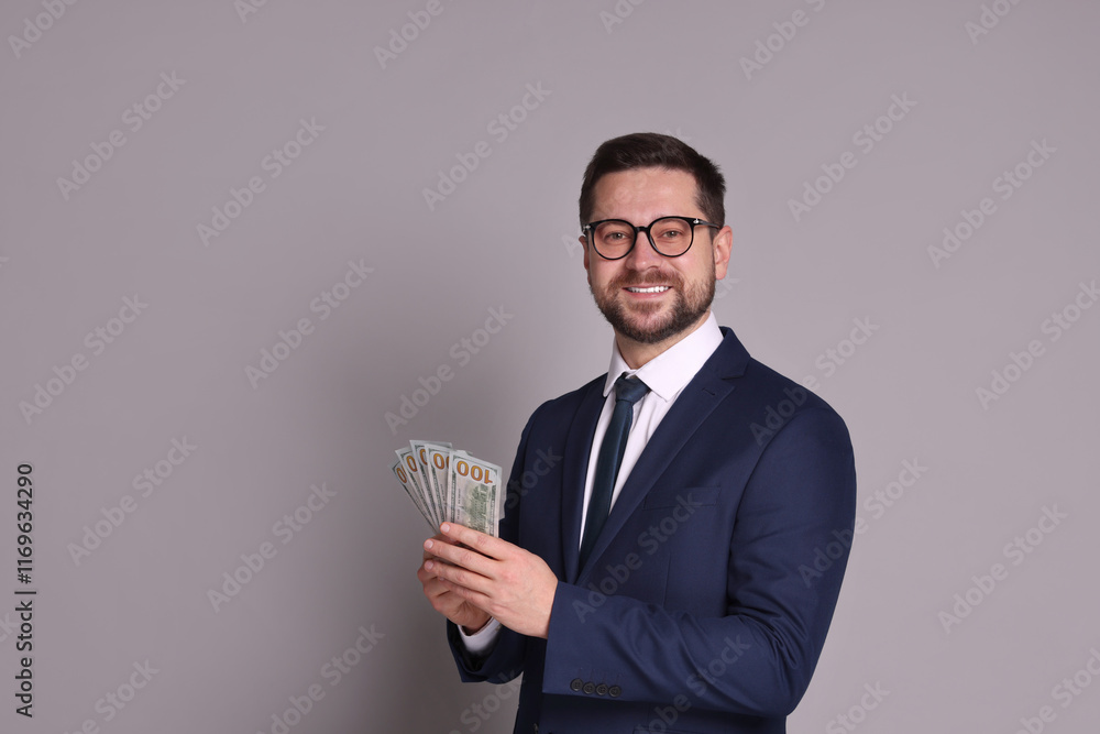 Portrait of banker with dollar banknotes on grey background, space for text Portrait of banker with dollar banknotes on grey background, space for text