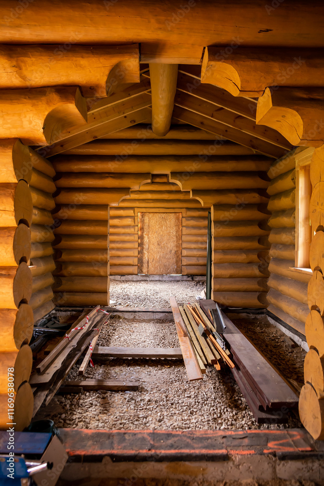 Interior of Partially Constructed Log Cabin with Wooden Log Walls Interior of Partially Constructed Log Cabin with Wooden Log Walls