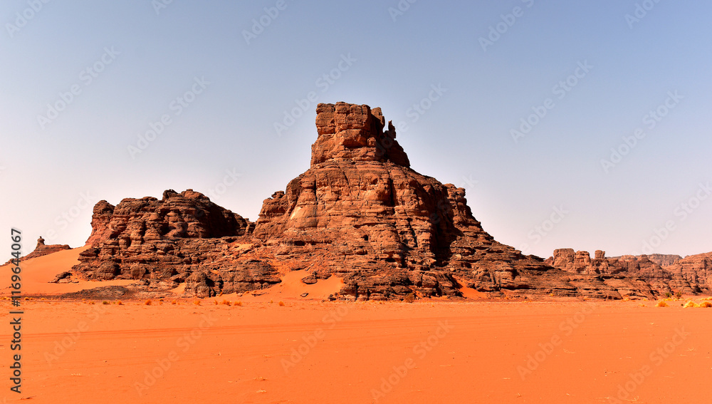Rock formations in Tadrart Rouge, Tassili N'Ajjer National Park. Sahara desert, orange sand and rocks. Holidays and travel in Algeria. Sahara, Algeria, Africa. Rock formations in Tadrart Rouge, Tassili N'Ajjer National Park. Sahara desert, orange sand and rocks. Holidays and travel in Algeria. Sahara, Algeria, Africa.