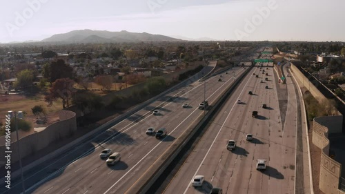 Aerial view of US-60 freeway, showing cars and trucks on road traffic on highway to downtown Phoenix. Urban modern city in USA, travel destination in America. Drone 4k. 