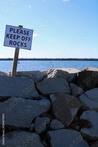 rocks with keep off the rocks sign