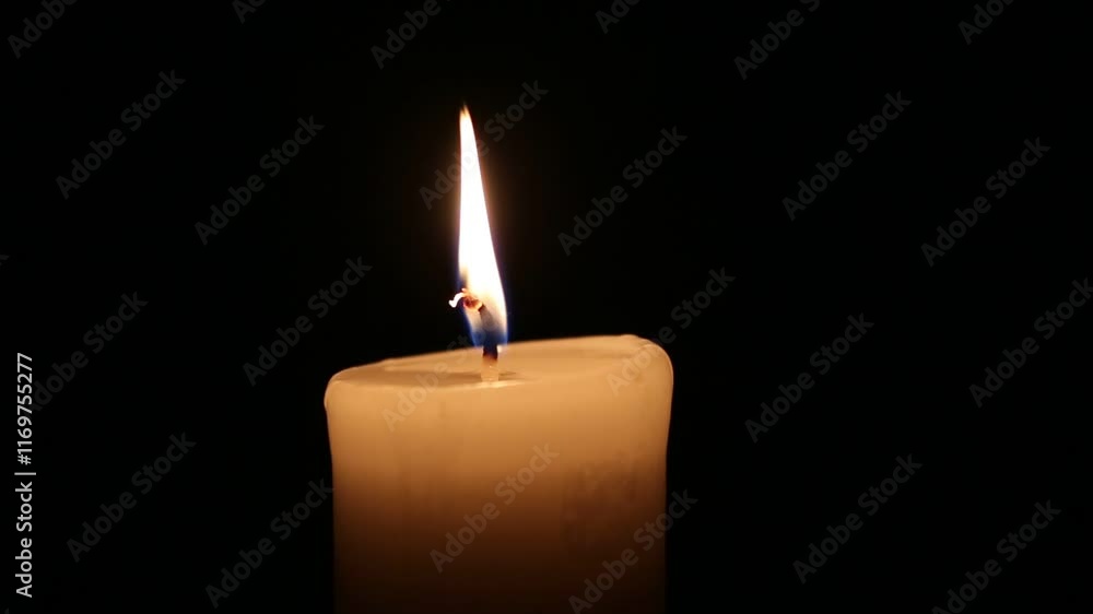 Close-up single candle beautiful burning on dark black background, candle fire flame light with empty space isolated. Ritual with romanric candle wax fire Close-up single candle beautiful burning on dark black background, candle fire flame light with empty space isolated. Ritual with romanric candle wax fire
