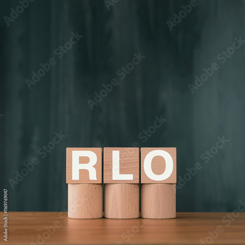 There is wood cube with the word RLO. It is an abbreviation for Recovery Level Objective as eye-catching image. photo