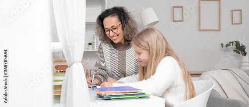 Little girl studying with t...