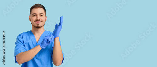 Male dentist on turquoise background