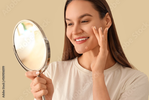 Young woman with pimple pat...